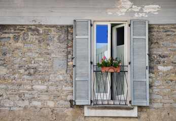 Italian window in an old stone house