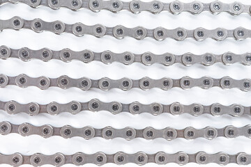 Closeup Background Texture of New Oiled  Roller Bicycle Chain Taken from Top View.