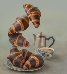 Flying chocolate muffins on gray background