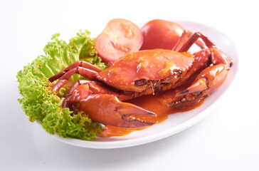 Delicious crabs cooked with sweet and sour sauce on white background