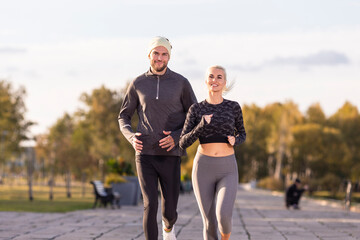 Jogging Ideas. One Positive Runners  Couple Posing Together During Running Training Fitness Exercise At Nature Outside as Runners During Training Outdoor Process