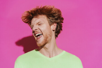 White young redhead man shaking his head and screaming at camera