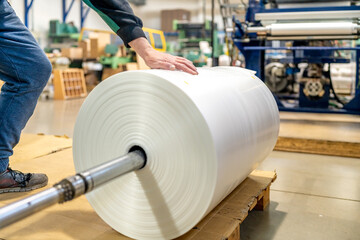 large plastic roll in the factory for the production of plastic packaging material and bags