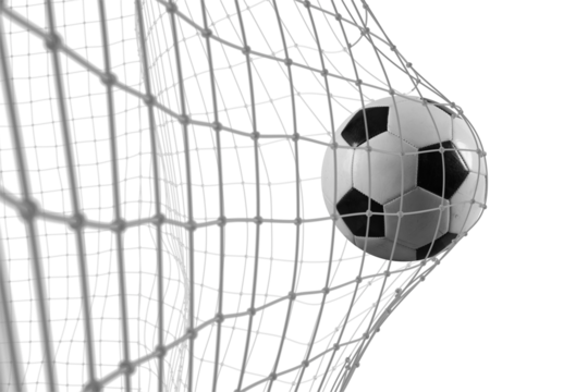 Soccer ball scores a goal on the net in a football match