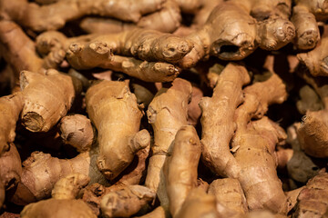 Ginger root in the supermarket close-up, food background.
