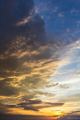 Naklejka na ściany i meble clouds in the sky illuminated by the sun summer evening. background