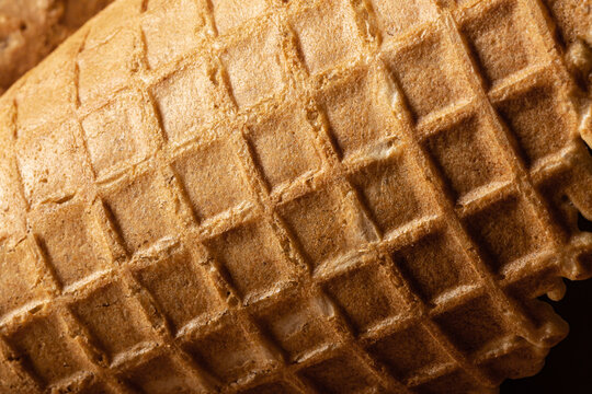 Ice cream cone close-up, waffle cone texture.