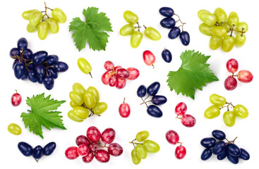 green pink and blue grapes with leaves isolated on the white background. Top view. Flat lay pattern