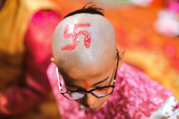 Hindu Swastik Sign in the head of Boy. Upanayana Ceremony for hindu boy. Brahmin Ceremony. Maharashtra Culture and Ritual