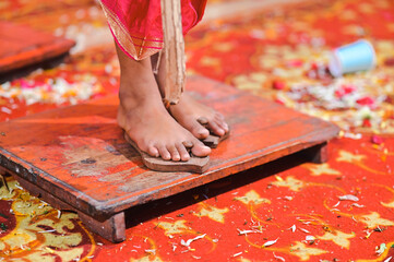 Wooden Slipper on the legs of boy in hindu ceremony. Paduka in Upanayana Ceremony. Worship for...