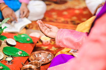 Hand In Himdu Holy worship. Green betel leaf and nut in hindu pooja. Maharashtrian culture. Hindu Rituals and Ceremony 
