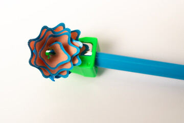 removing lead from a blue pencil with a pencil sharpener