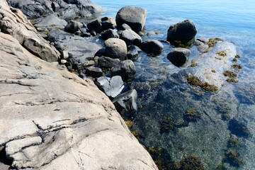 rocky coastline, huge stone in the water