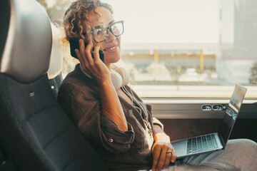 Communication and travel concept job lifestyle. Modern woman smile and using mobile phone sitting...
