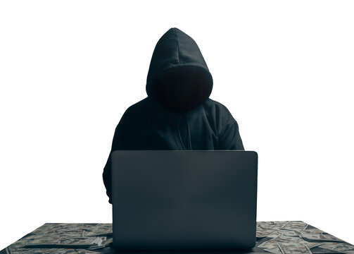 anonymous young man hacker sitting playing laptop with lots of money lying around.Concept Massive financial theft transparent background. png.file