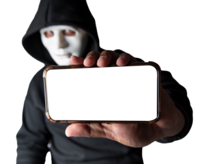 Close-up. An anonymous hacker wearing a mask and black hoodie shows off a smartphone with a blank white screen. Hacking and malware concept. Transparent background. png.file