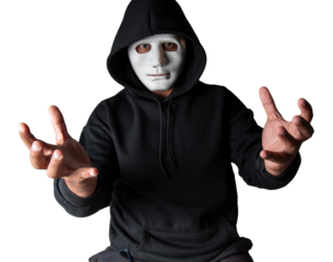 A portrait of an anonymous hacker wearing a mask and a black hoodie sitting with his head tilted and terrifying with clipping path. Hacking and malware concept.