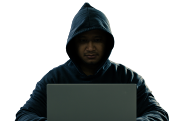 anonymous young man hacker sitting playing laptop with lots of money lying around.Concept Massive financial theft transparent background. png.file