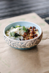 Traditional Ukrainian dish Banosh. Corn porridge in butter sprinkled on fried lard and sheep's cheese