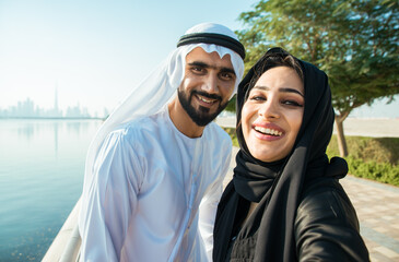 Happy couple walking in Dubai. Man and woman going out for shopping. Concept about relationship in the uae
