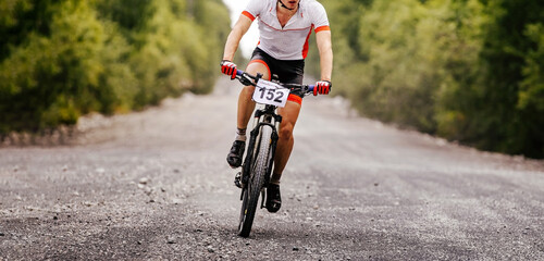 Fototapeta na wymiar cyclist rider riding on gravel road on mountain bike