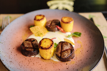 Veal filet mignon with fried potatoes. Delicious 