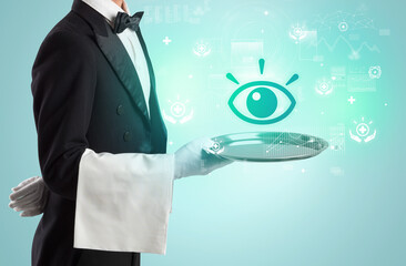 Handsome young waiter in tuxedo holding healthcare icons on tray