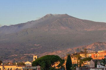 View of Mount Etna from the city of Taormina / View of Mount Etna volcano in the morning, from the city of Taormina on the island of Sicily, Italy. - 573494149