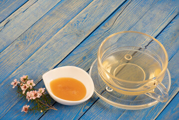 Manuka honey mix hot water for drink on nature background.