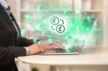 Young man watching stock market on laptop