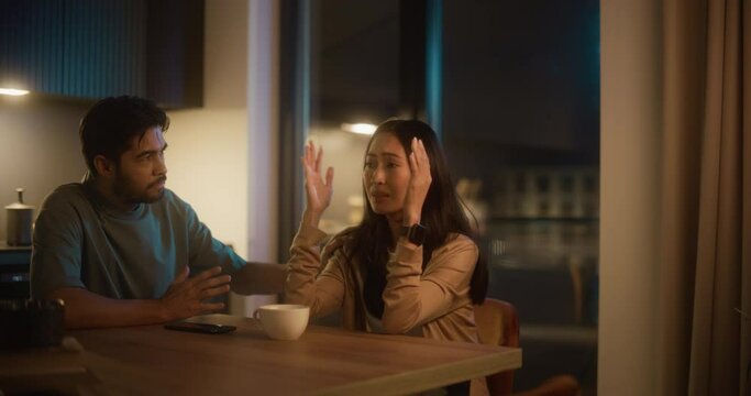 Healthy Relationship Concept: Couple Working Through Problems Together by Communicating. Boyfriend Calming his Worried and Distressed Girlfriend, Talking to Her, Hugging Her, Validating her Feelings