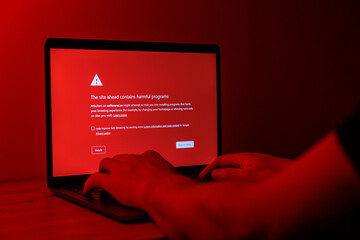 Red screen with malware warning. Visiting fishy websites with viruses