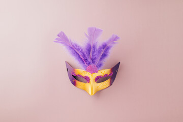 Happy Purim carnival. Carnival mask for Mardi Gras celebration isolated on purple background banner...