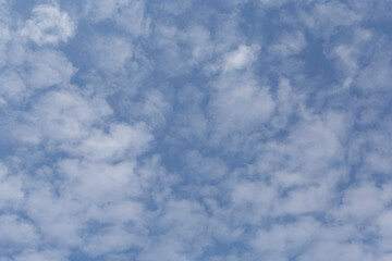 natural backdrop: white clouds in a blue sky