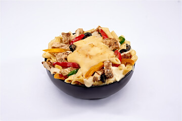pasta, cheese with chicken, and vegetables in a dish on isolated white background