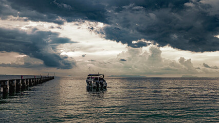 Pier and a boat after the storm