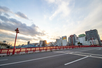 High-rise building photographed from below with blue sky background.