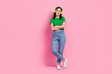 Full body portrait of gorgeous lovely girl folded hands look empty space isolated on pink color background