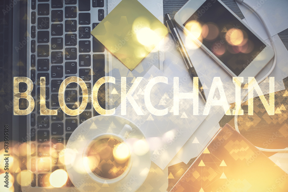 Poster Blockchain theme hologram drawings over computer on the desktop background. Top view. Multi exposure. Concept of cryptoeconomy.
