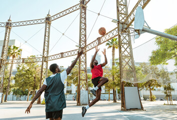 Young basketball players training at the court.