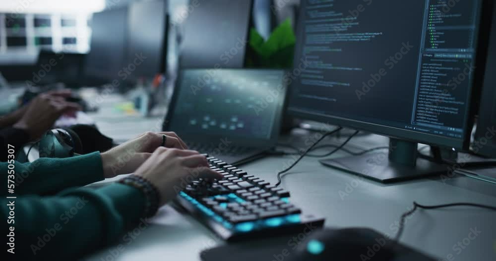 Fototapete Close Up of a Software Developer Working on a Desktop Computer, Programming Code Running on Display. Specialist Typing on Keyboard, Coding and Implementing a Technical Feature, Working in an Agency
