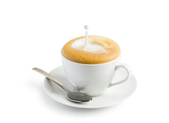 Cup of cappuccino with splashing milk on white background