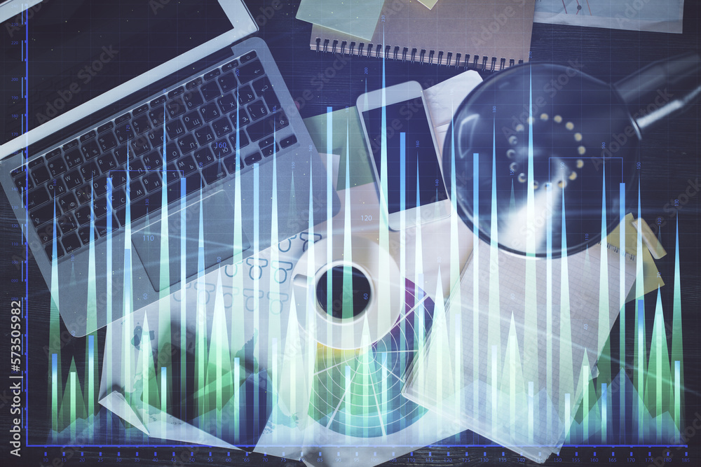 Poster financial market graph and top view computer on the desktop background. multi exposure. investment c