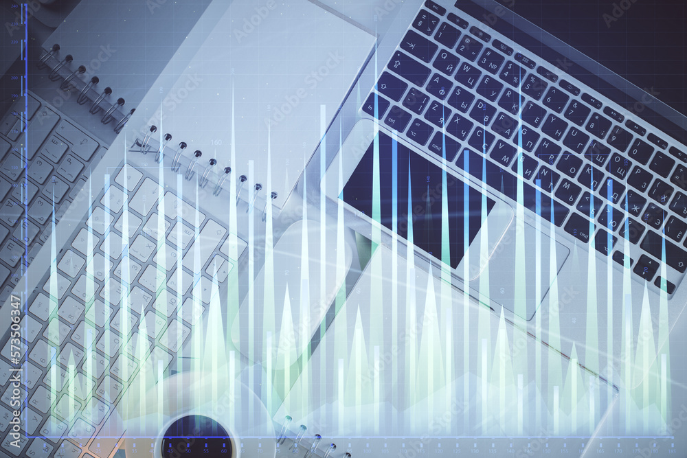 Poster financial market graph and top view computer on the desktop background. multi exposure. investment c