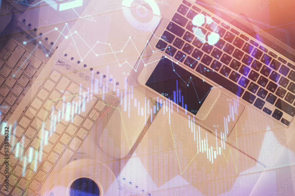 Poster financial market graph and top view computer on the desktop background. multi exposure. investment c