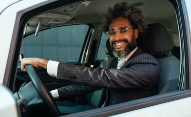Young business man driving his car
