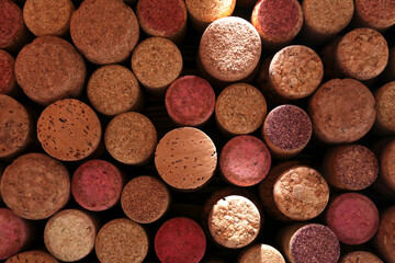 Obraz na płótnie Canvas Many corks of wine bottles as background, top view