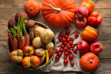 Different fresh ripe vegetables and fruits on wooden table, flat lay