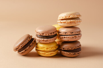 Pastel shades french macarons or macaroons (almond cookies) on the  background