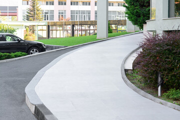 Beautiful city street with rising road on autumn day